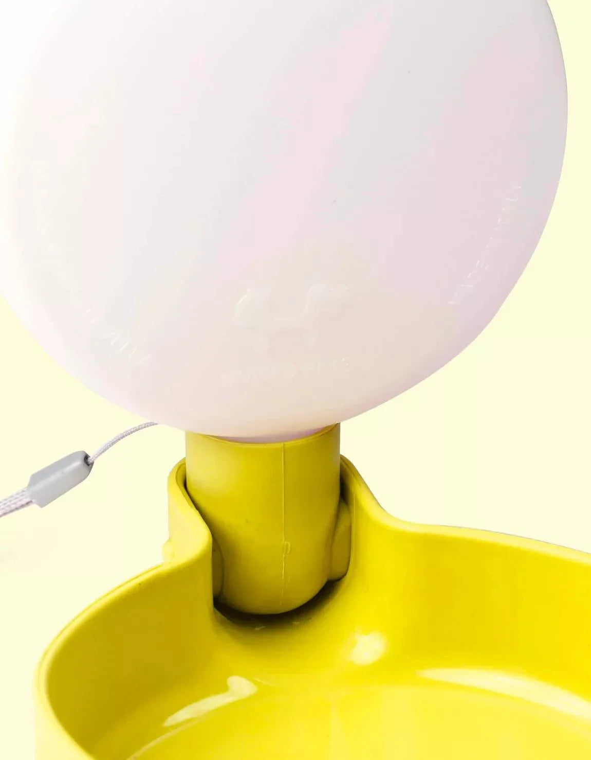 Yellow travel water bottle for dogs with anti-drip valve.