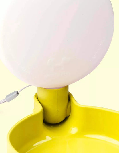 Yellow travel water bottle for dogs with anti-drip valve.