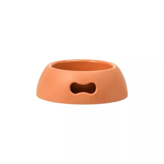 Indestructible eco-friendly orange bowl for dogs and cats with non-slip rubber feet and handle.